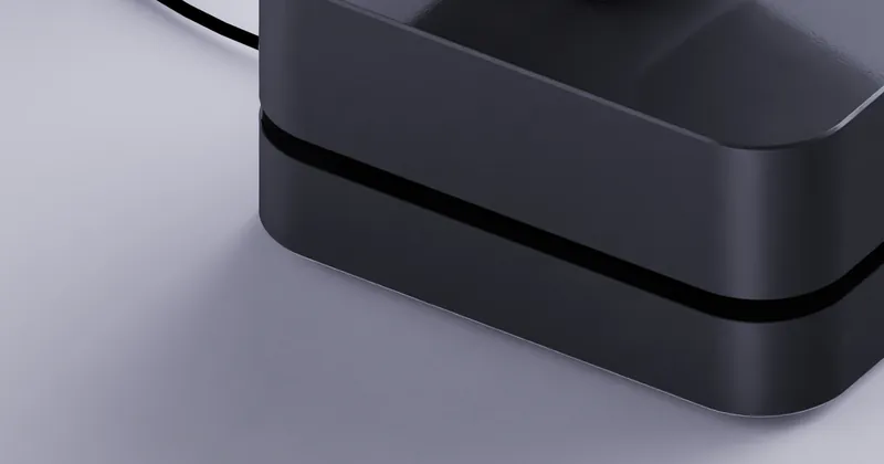 The MARK One base docked at its charger, close up