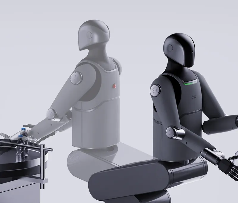 Two MARK One robots moving between workstations