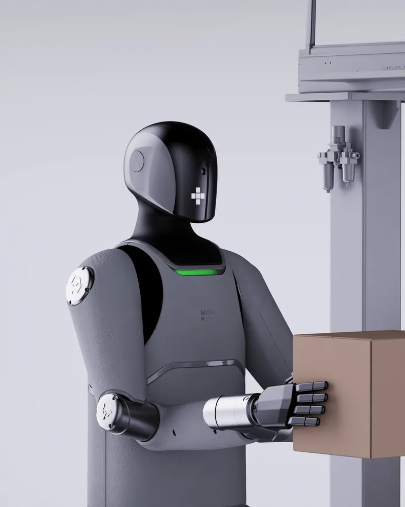 MARK One lifting a cardboard box next to a stack of boxes