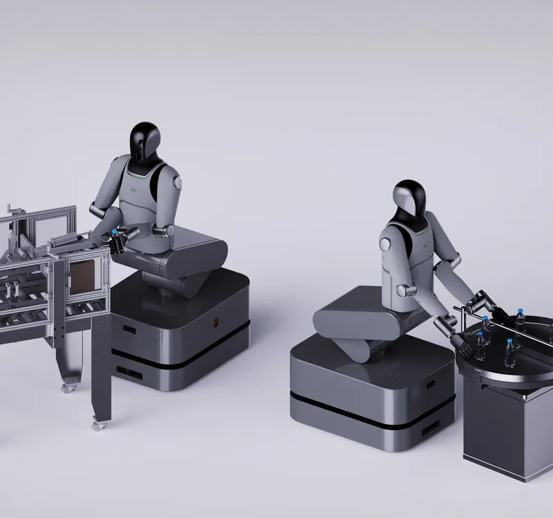 Two MARK One robots carrying items between workstations