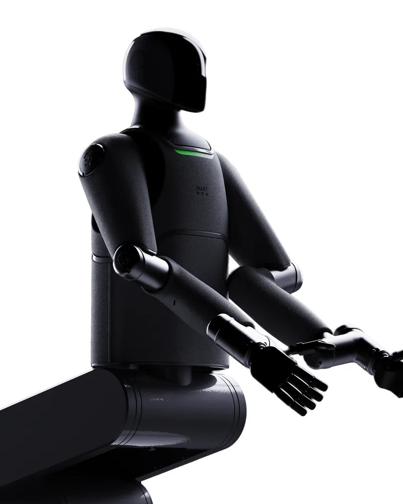 MARK One seated, hands reaching forward
