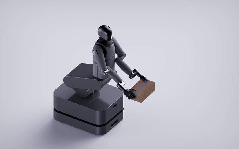 Robot carrying a cardboard box on a moving base